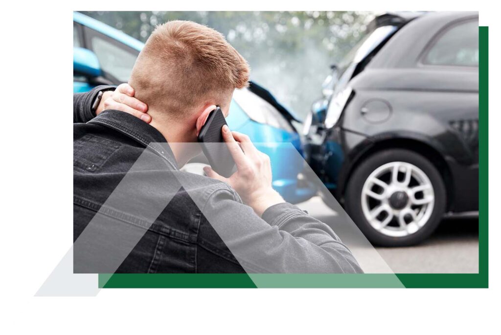Man on phone after car accident